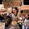 Young women protest with pro-Palestinian signs that say things like "Free Palestine"