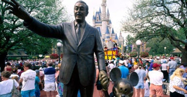 Walt Disney and Mickey Mouse statues holding hands