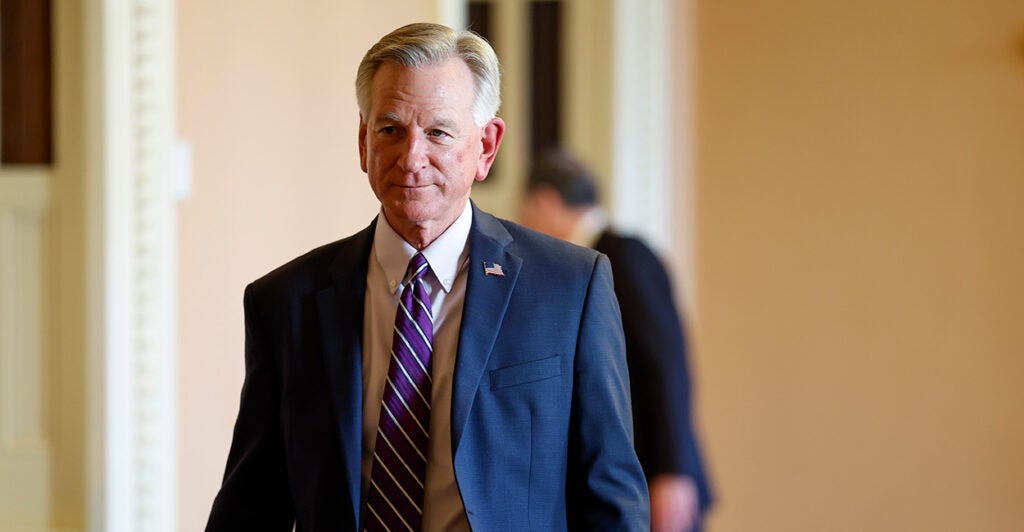 Sen. Tommy Tuberville walks the halls of Congress.