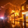 A firefighter battles a raging wildfire on Wednesday in Los Angeles.