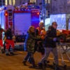 Ambulance crews ferry the injured on stretchers away after a terrorist attack on Dec. 20 in Magdeburg, Germany.