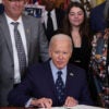 President Joe Biden signs an executive order at the White House.