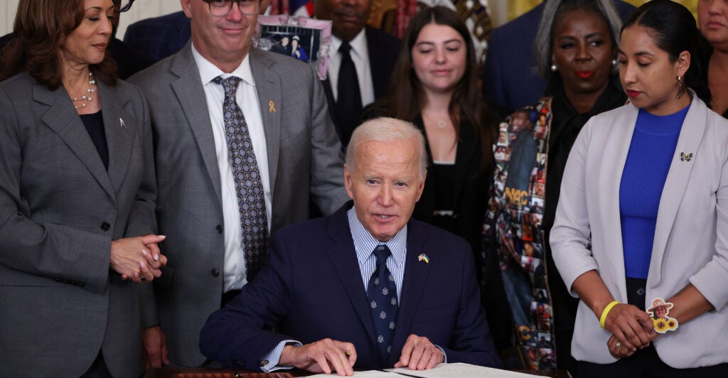 President Joe Biden signs an executive order at the White House.