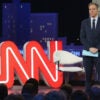 CNN’s Jake Tapper and the CNN logo