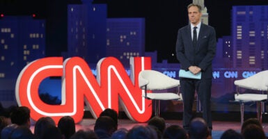 CNN’s Jake Tapper and the CNN logo