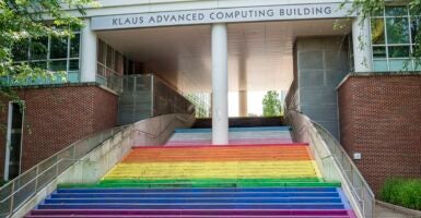 The steps leading inside to a college building have been painted the rainbow colors.