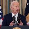 President Joe Biden speaks at a podium.