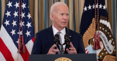 President Joe Biden speaks at a podium.