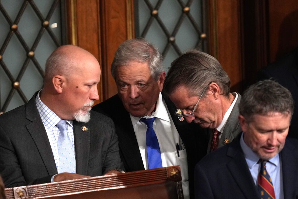 Republican Reps. Chip Roy of Texas, Ralph Norman of South Carolina, Tim Burchett of Tennessee, and Thomas Massie of Kentucky confer.