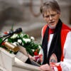 Episcopal Bishop Mariann Edgar Budde in clerical garb at the pulpit