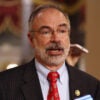 Rep. Andy Harris in a dark suit and red tie in the hallway of the U.S. Capitol