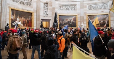 Supporters of President Donald Trump walk around in the Rotunda of the U.S. Capitol on Jan. 6, 2021.