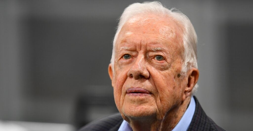 Jimmy Carter looks on in 2018 while he was attending a football game.