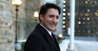 Justin Trudeau smiles in a suit