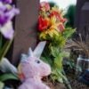 Flowers, sneakers and a stuffed animal are placed at a memorial site on the campus of the University of Georgia in memory of slain Laken Riley.