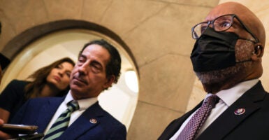 Democratic Reps. Jamie Raskin of Maryland (left) and Bennie Thompson of Mississippi. Thompson is wearing a COVID-19 mask.