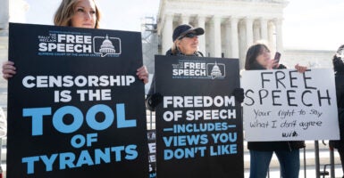 Free speech demonstrators protest Big Tech censorship in front of the U.S. Supreme Court with signs that include “censorship is the tool of tyrants.”