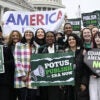 Several female protesters outside the U.S. Capitol holding up signs urging adding the equal rights amendment to the Constitution of the United States