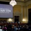 The words "January 6th" was displayed on a large video screen in the U.S. House select committee hearing.