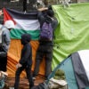 A group of pro-Palestinian protesters put up a Palestinian flag as they take over UC Berkeley's condemned Anna Head Alumnae Hall in Berkeley, Calif., on May 15, 2024.