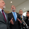 Members of the conservative House Freedom Caucus speak to reporters.