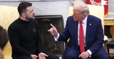 President Donald Trump sits and wags his finger at Ukrainian President Volodymyr Zelenskyy .