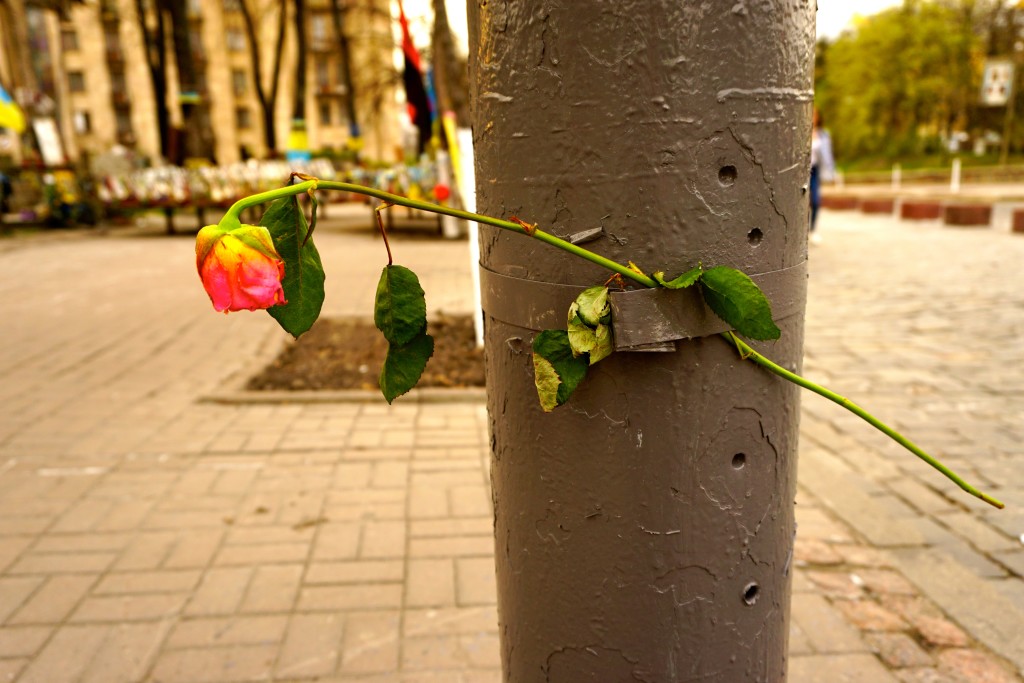 Bullet holes still mark a street sign post in central Kyiv, a reminder of the 2014 revolution. (Photo: Nolan Peterson/The Daily Signal)
