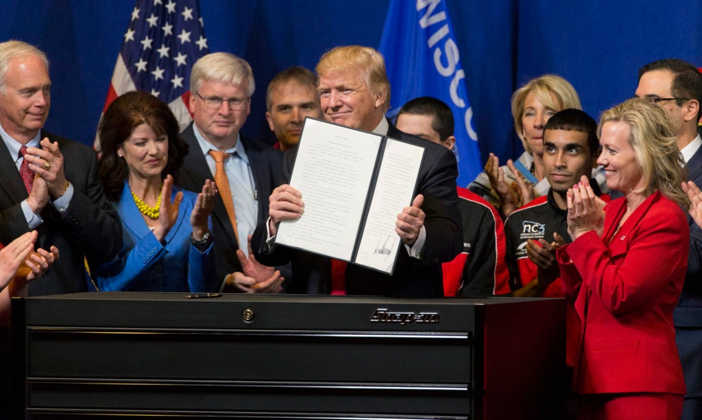 President Donald Trump announces an executive order that directs federal agencies to suggest changes to the H1-B visa program, to ensure visas are awarded to the most skilled, best-paid immigrant workers. (Photo: Mark Hoffman/TNS/Newscom)